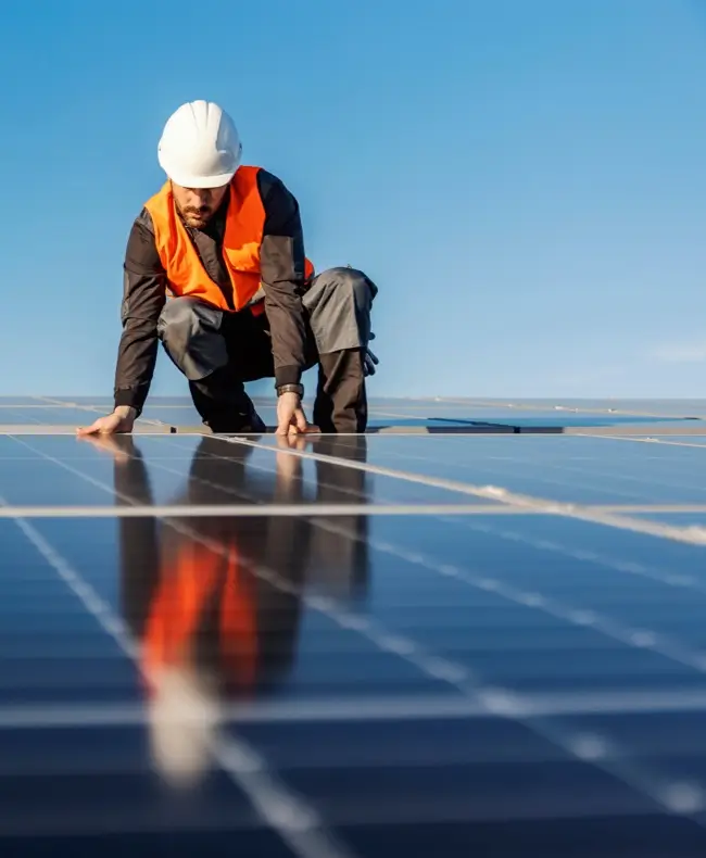 man arranging solar panel