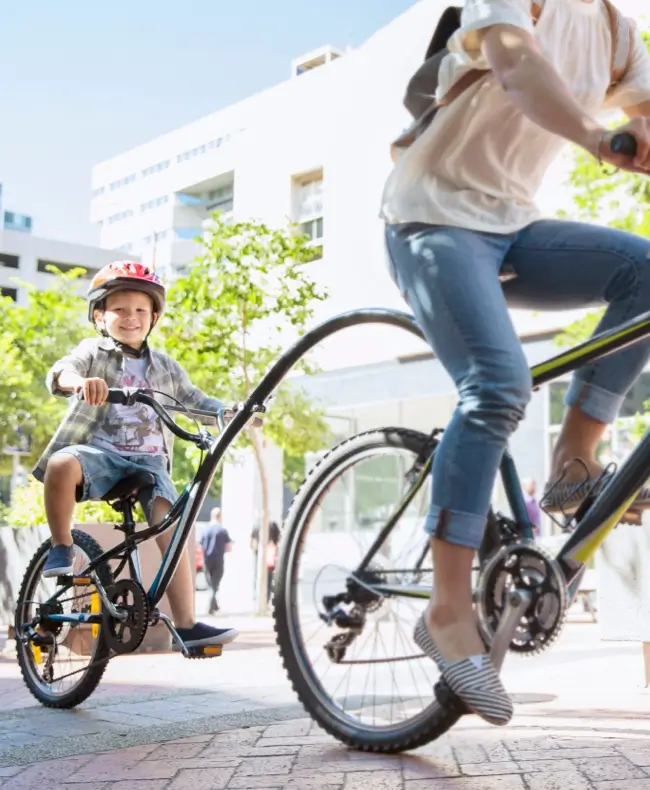 young kid following with bike