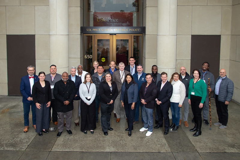 A group photo of participants at the Exec Ed forum